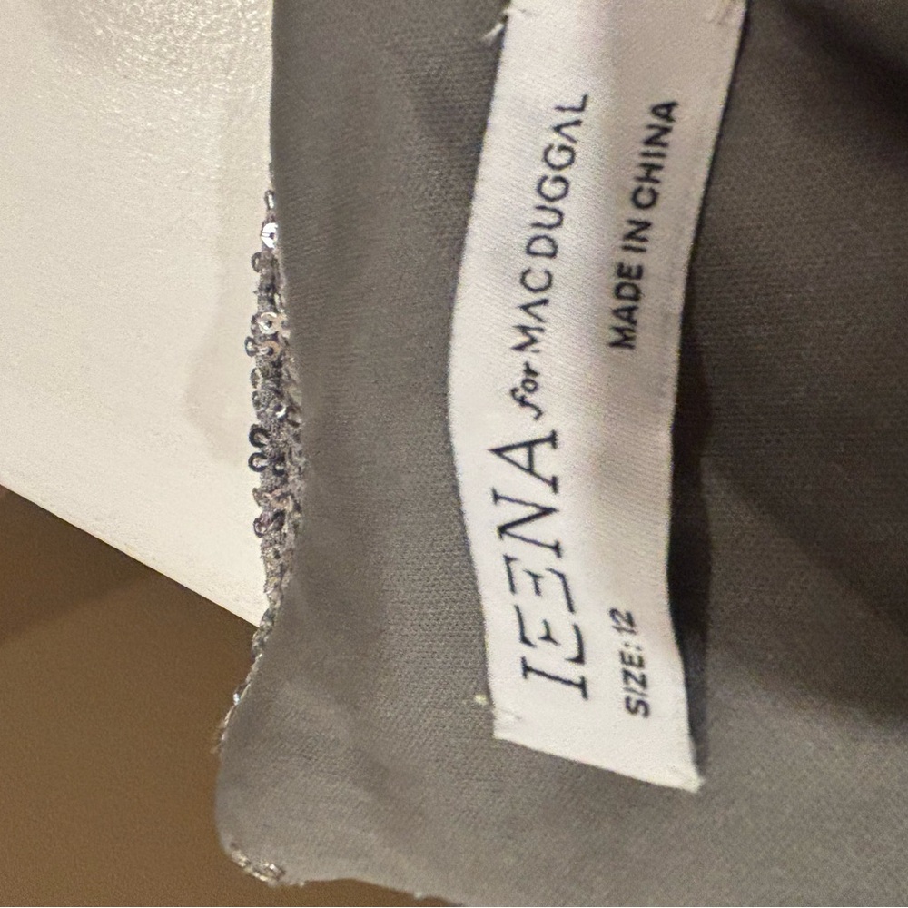 Mac duggal silver sequined dressss size 12 with slit. All sales final